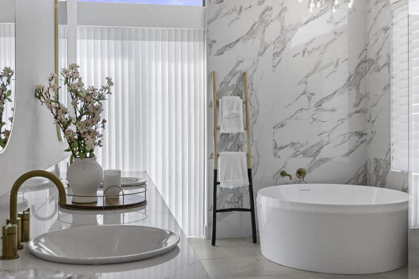 fancy marble bathroom with cooling blinds